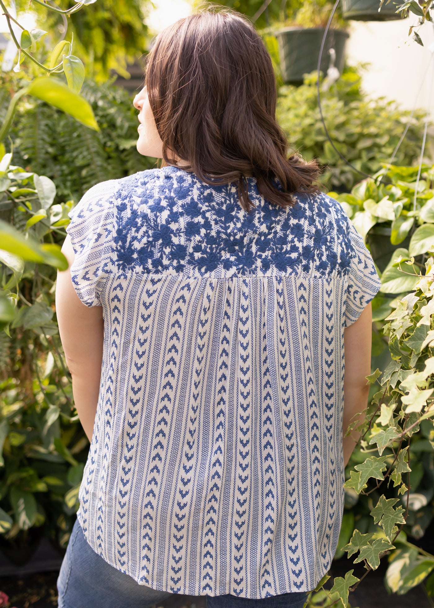 Back view of a plus size navy top