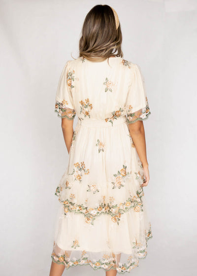 Back view of a wild flower taupe dress