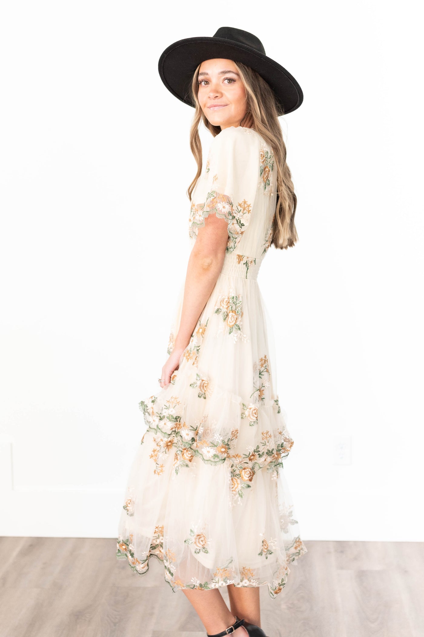 Side view of a wild flower taupe dress