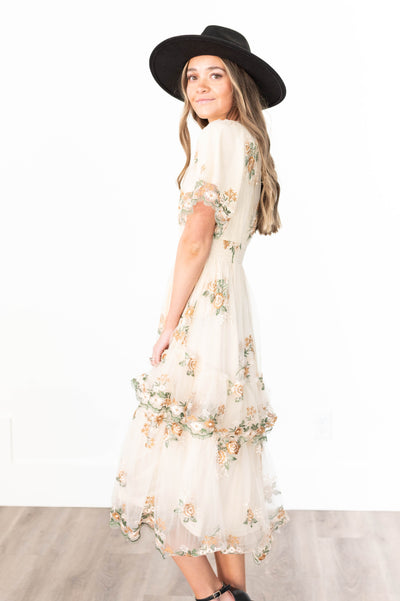 Side view of a wild flower taupe dress