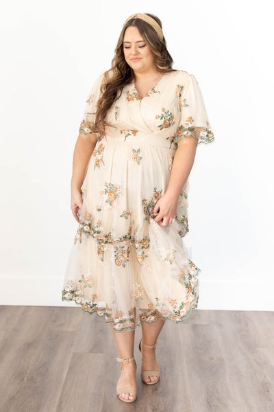 Plus size taupe floral dress with short sleeves and lace trim