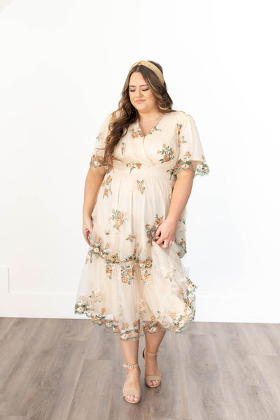 Plus size taupe floral dress with short sleeves and lace trim