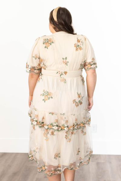 Back view of a flower taupe dress