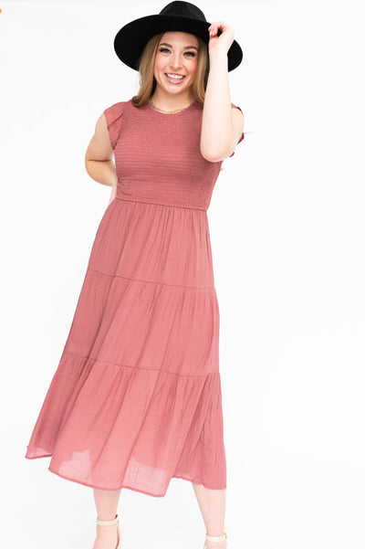 Dusty mauve dress with cap sleeves, smocked bodice and tiered skirt