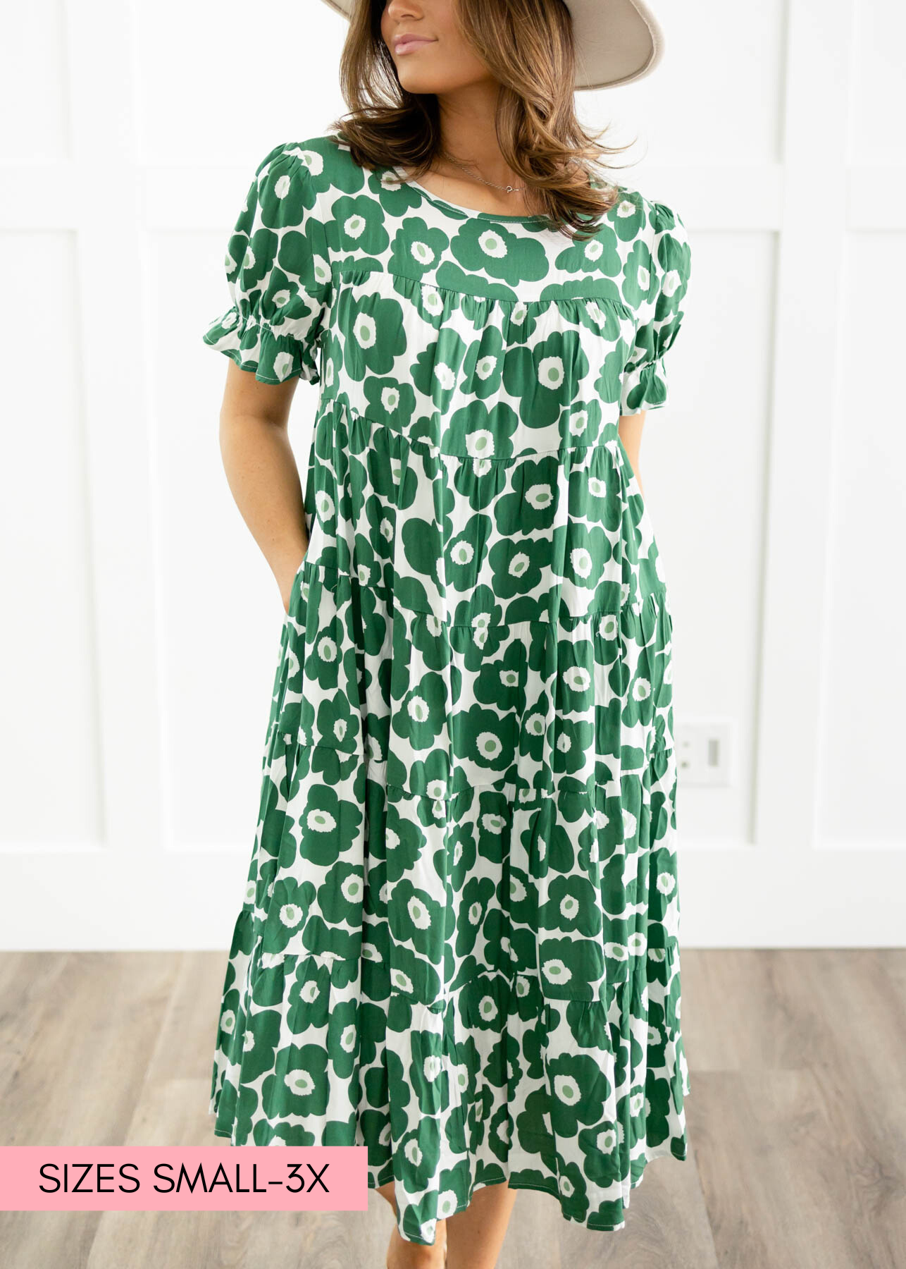 Green floral dress with a tiered skirt and pockets